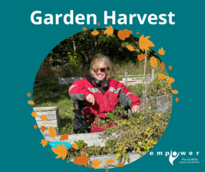 An Empower N L member harvests produce from accessible garden beds. Title reads Garden Harvest. The Empower N L Logo is in the lower right corner.